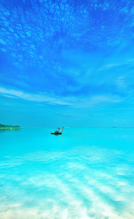 Beautiful seascape with a boat on the sea and blue skyの素材