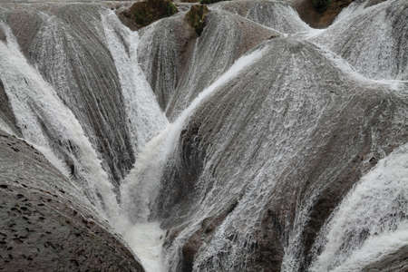 Water flows down from the mountain