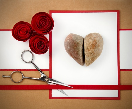 A valentine made of rock paper and scissors, the rocks are in the shape of a heart. Room for copyspace.の写真素材