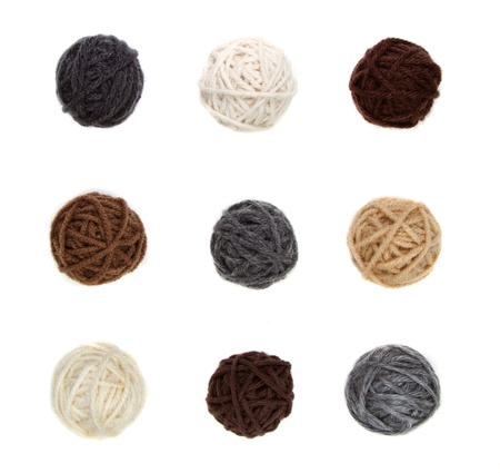 Nine different balls of yarn in neutral colors isolated on a white backgroundの写真素材