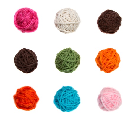 Colorful balls of yarn in nine different colors isolated on a white backgroundの写真素材