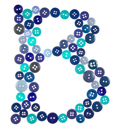 The letter B made of photographed buttons, isolated on a white backgroundの写真素材