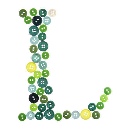 The letter L made of photographed buttons, isolated on a white backgroundの写真素材