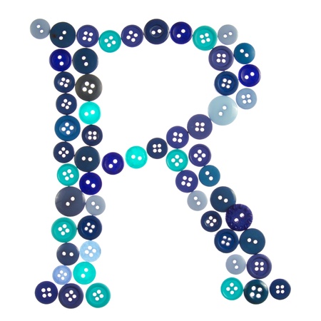 The letter R made of photographed buttons, isolated on a white backgroundの写真素材
