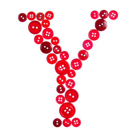 The letter Y made of photographed buttons, isolated on a white backgroundの写真素材