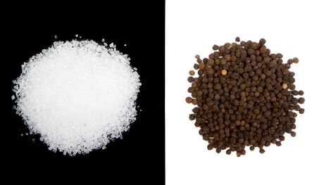 Sea salt and pepercorns isolated on both white and black backgroundsの写真素材