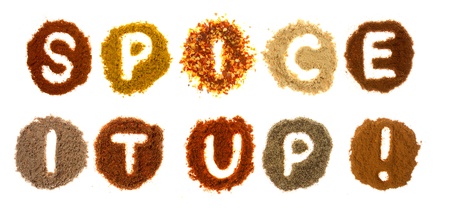 Assorted spices spelling the word spice it up, isolated on a white backgroundの写真素材