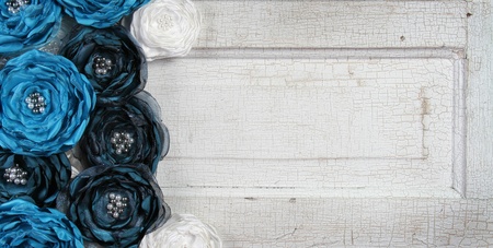 Blue vintage flowers on an antique doorの写真素材
