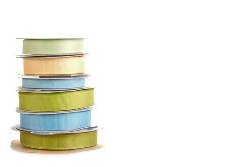 spools of ribbon stacked on white backgroundの写真素材