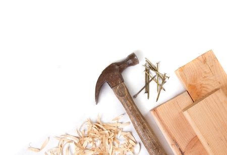 Hammer, nails and boards on a white backgroundの写真素材