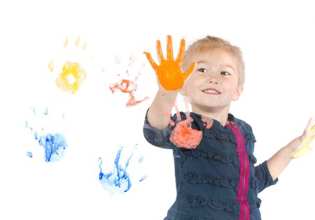 Little girl painting handprints on window, isolated on white backgroundの写真素材