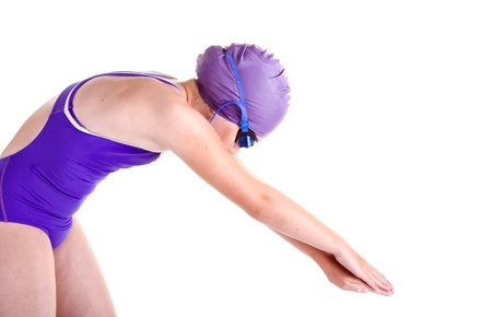 young competitive swimmer in dive pose, isolated on whiteの写真素材