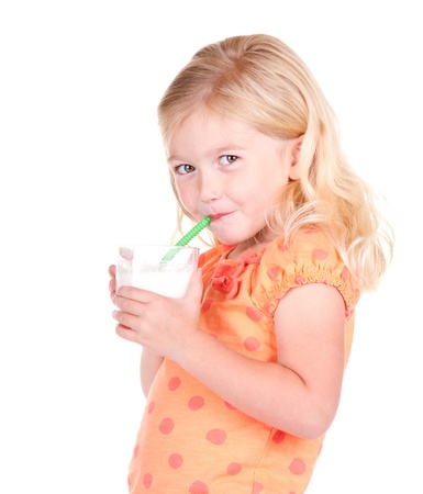 Child drinking milk isolated on whiteの写真素材