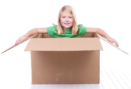 girl in cardboard box, on white backgroundの写真素材