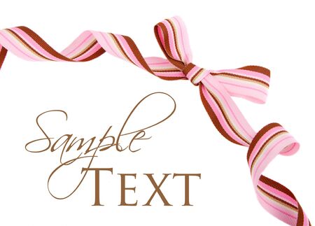 Pink and brown striped grosgrain ribbon and bow isolated on whiteの写真素材