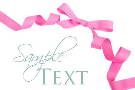 Pink grosgrain ribbon and bow isolated on whiteの写真素材