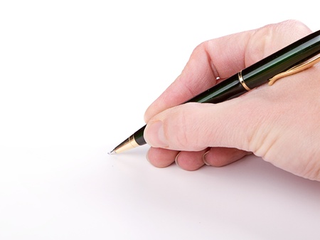 Writing with pen on a white backgroundの写真素材