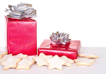 Christmas present and cookies on white backgroundの写真素材