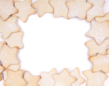 Star Christmas cookies framed on white background の写真素材