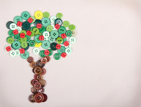 Apple tree made of buttons on fabric backgroundの写真素材