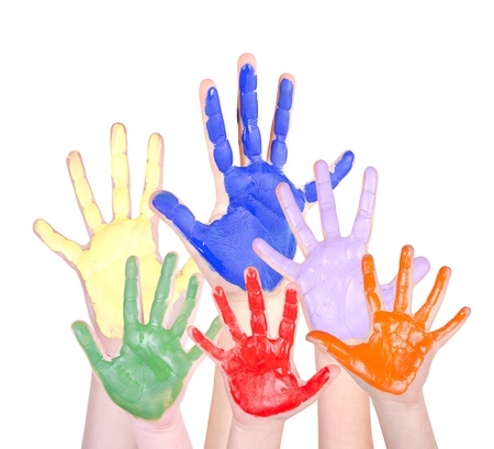 Painted hands in rainbow colors raised, isolated on a white backgroundの写真素材