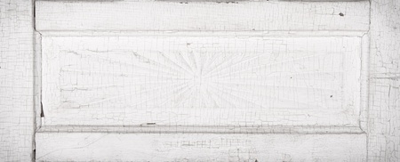 Antique white cracked wooden door panel with architecture detailの写真素材