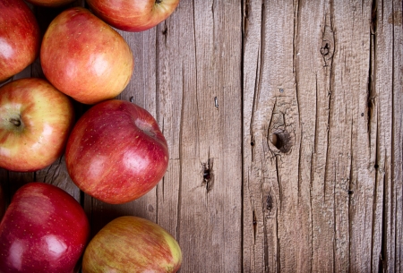 Apples on rustic wooden plank
