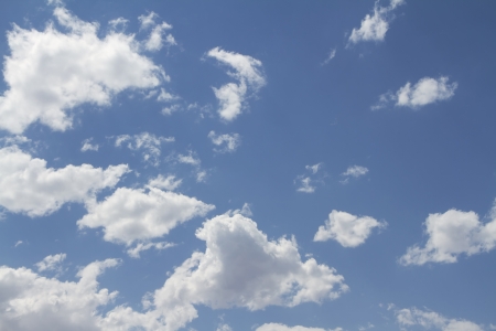 Fluffy clouds on blue sky for backgroundの写真素材