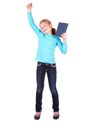 Child or girl holding book above head isolated on white backgroundの写真素材