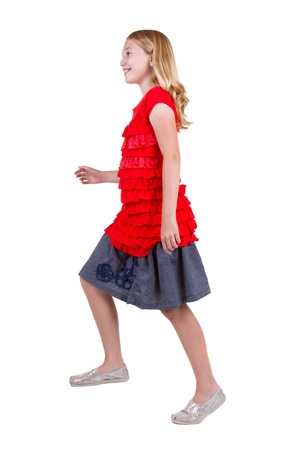 Young teen in the action of stepping up, isolated on whiteの写真素材