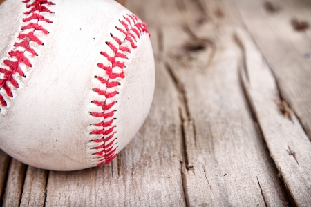 Close-up of baseball on rustic wooden backgroundの写真素材