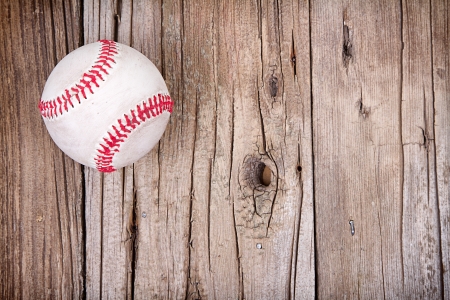 Baseball on rustic wooden backgroundの写真素材