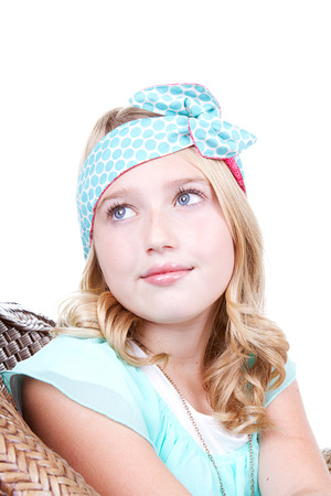 Fashionable young girl wearing vintage fabric headband, isolated on whiteの写真素材