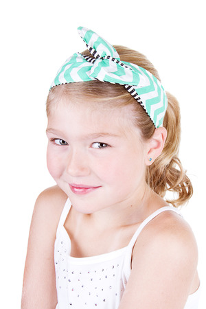 Fashionable young girl wearing vintage fabric headband, isolated on whiteの写真素材