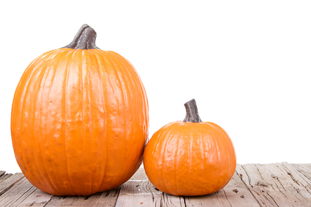 Pumpkin on wooden plank with isolated white backgroundの写真素材