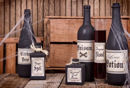 Potion bottles on rustic wooden planksの写真素材
