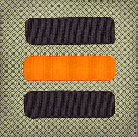 Halloween colored ribbon tags on a scrapbook paper backgroundの写真素材