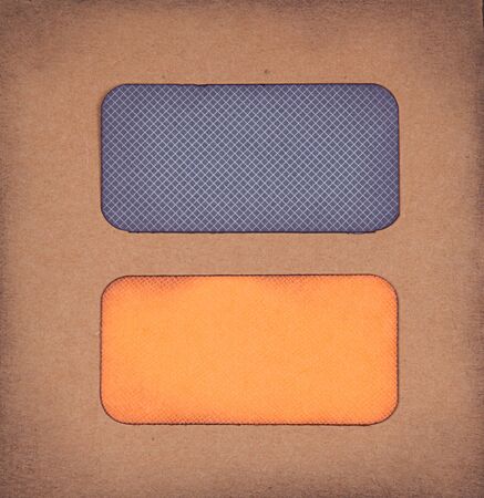 Halloween colored paper tags on paper background for copy spaceの写真素材
