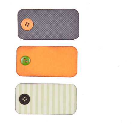 Halloween colored ribbon tags with buttons isolated on whiteの写真素材