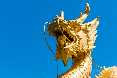 Golden Dragon statue in Phuket town.の写真素材
