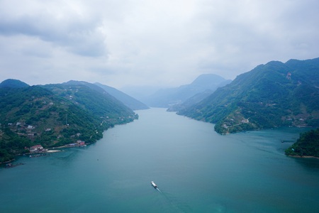 Boat moving through two mountainsの写真素材