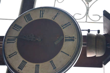 old clock on a white backgroundの写真素材