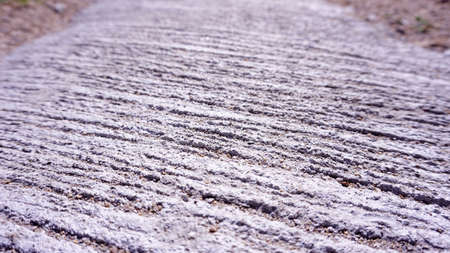 The rough concrete surface has been scratched for further improvement.