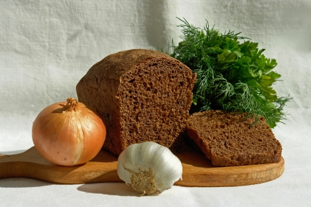 still life with bread, onion, garlic, parsley, dill                               の写真素材
