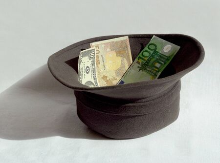 A hat for charity with moneyの写真素材