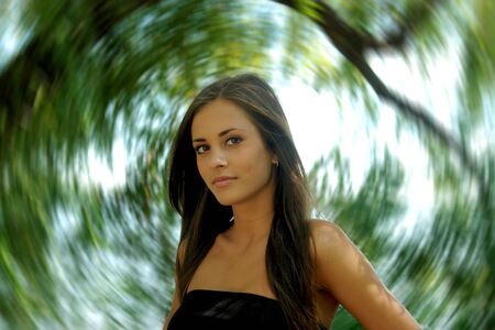A girl with long hair on a radial blurred background                               の写真素材