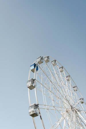 Ferris wheel of the amusement park in the blue sky background. Volgograd, Russia.の写真素材