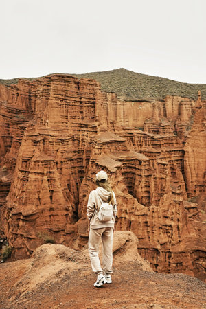 Girl hiker in Kok-Moinok canyon, Kyrgyzstan.