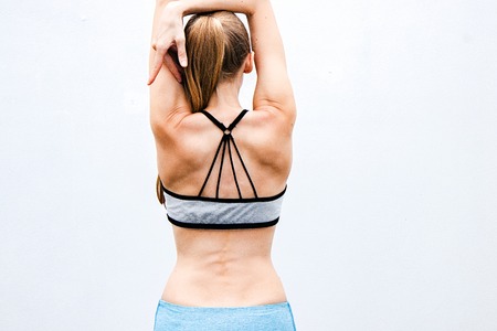 Female fitness model. Athletic beautiful woman. Back view.