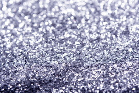Silver glitter texture. Festive sparkling sequins background closeup. Luxury shiny walpaper for the day of St. Valentine, New Year, Unniversary celebration and Christmas Holidays.の写真素材